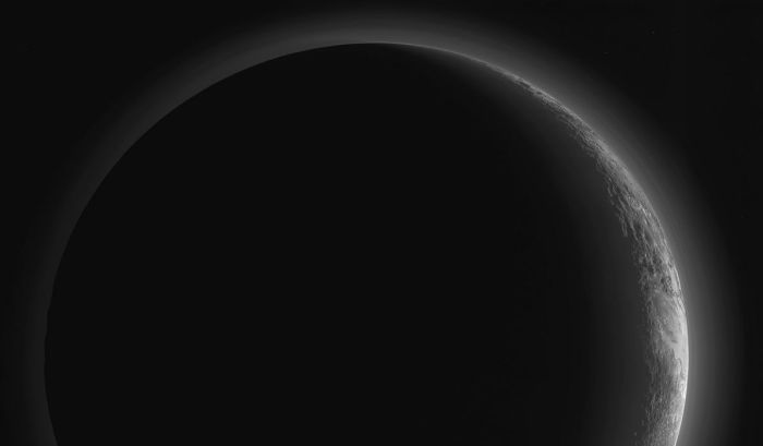 An enhanced image of Pluto's night side, composed of images captured by the MVIC instrument on New Horizons on July 14th, 2015. As Pluto is "tipped over" on its axis by 120 degrees, the planet's north pole is to the right and south pole to the left 