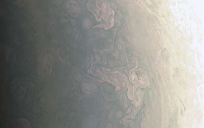 An enhanced view of the north polar hurricane-like clouds images by Juno on August 27th, 2016